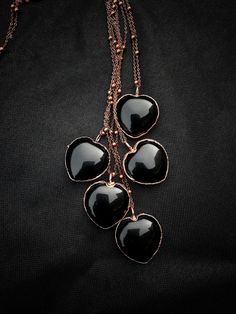 Black Obsidian gemstones pendants available You can choose your size pendant and length chain (the measure is available in the photo gallery). Pendante size  30x30 mm This necklace is made with a black obsidian electroformed into a setting of dripping copper and exudes raw elegance. Each heart and the way I apply the copper are slightly different. Copper plated through a galvanization process. The result is spectacular because copper amplifies the energy of the stone with which it is combined. C Black Metal Jewelry For Valentine's Day, Valentine's Day Black Metal Jewelry, Black Metal Heart Charm Necklace, Black Metal Heart Necklace With Charm, Black Heart Charm Pendant Jewelry, Black Metal Necklace With Heart Charm, Black Metal Heart Necklace With Heart Charm, Black Pendant Jewelry With Heart Charm, Black Metal Heart Necklace For Valentine's Day