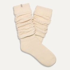 We take lounging VERY seriously, so trust us when we say the Clarice Tall Slouchy Sock is the "it girl" when it comes to comfy socks. Soft, dreamy, and super cozy, you can wear these pulled up to the knee or slouched down. Tall slouchy chenille sock 99% Polyester / 1% Elastane 18" height Soft twill tape with The UGG® Logo on top cuff Fits shoe size: 5-10 Imported Style #1161650 Cozy Snug Knee-high Socks, Cozy One Size Socks For Stocking Stuffer, Cozy Soft Knee-high Socks, Cozy Leg Warmers For Loungewear, Cozy Soft Socks One Size, Cozy Mid-calf Socks For Stocking Stuffers, Cozy Fit Leg Warmers For Loungewear, Cozy One Size Mid-calf Socks, Cozy Soft One-size Socks