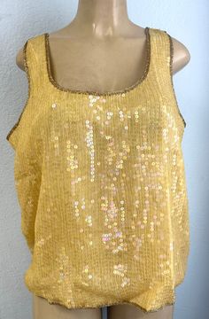 This sequin top is handmade, high quality, original design and beautiful. This top is suitable for party, events or any occasional use. Disco Style Sleeveless Party Tops, Embellished Sequin Fabric For Summer Night Out, Summer Party Embellished Sequin Fabric, Embellished Sequin Fabric For Summer Party, Fitted Sequin Fabric For Festivals, Sequin Stretch Blouse For Night Out, Stretch Sequined Blouse For Night Out, Disco Style Sleeveless Evening Tops, Sleeveless Disco Tops For Evening