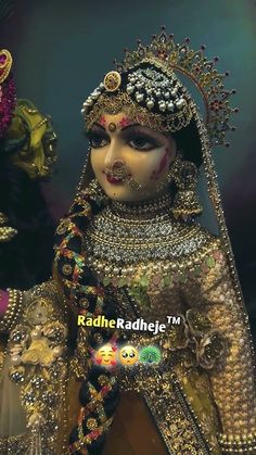 an elaborately dressed woman in costume and headdress with beads on her face