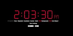 an alarm clock displaying the time in red on a black background with text reading 2 00 pm