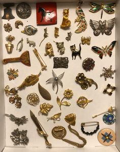 You're buying a collection of vintage jewelry as a wholesale job lot, junk drawer group. ONE price for ALL. Price has been reduced to rock bottom. You are buying around 47 (or so) pieces in all, and while most are in very good condition, some are missing the backings or a few stones,etc. Some highlights include awesome figural brooches with cats, dogs, a snail, butterflies, birds, florals, a windmill, a liberty bell, real cultured pearls, marcasites, and more. I've included photos for details an Retro Collectible Jewelry Brooch, Retro Collectible Brooch Jewelry, Retro Gold Collectible Pins, Gold Brooch With Vintage Charm For Collectors, Antique Costume Jewelry, Liberty Bell, Antique Brooches, Rock Bottom, Jewelry Lookbook