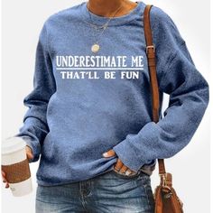 Round Neck Casual Sweatshirt. Graphic On Front States “Underestimate Me That Will Be Fun” T8 Casual Blue Slogan Tops, Casual Blue Tops With Slogan, Blue Slogan Top For Winter, Blue Text Print Sweatshirt For Spring, Blue Casual Sweatshirt With Text Print, Blue Relaxed Fit Sweatshirt With Slogan, Blue Winter Tops With Text Print, Blue Text Print Top For Winter, Blue Text Print Tops For Winter