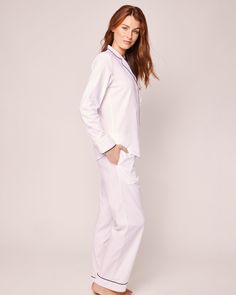 Classic white never goes out of style. Crisp, versatile, and always on-trend. This elegant white pajama set is accented with navy piping and finished with logo buttons. Premium 100% cotton twill makes this design crisp, comforting, and cozy. The moisture-wicking weave is yarn-dyed to help prevent fading. Cotton twill becomes more buttery with every wash. You will be tucked in luxury and off to dreamland. Bonne nuit. Classic White Cotton Sleepwear, Classic Cotton Sleepwear For Pajama Party, Classic White Sleepwear For Pajama Party, Classic White Long Sleeve Sleepwear, Classic White Relaxed Fit Sleepwear, White Pajama Set, White Cotton Pajamas, Cotton Pajama Set, White Pajamas