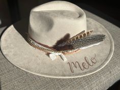 "Wedding Custom hand burned wide brimmed Boho Western Hat made to order just for you.  Colors: Cream Sand (Light Tan) Cognac (Dark Tan) When my dad passed away, I made my mom a hat to commemorate him... with places they've traveled, songs they sung, and things that reminded her of him. I loved it so much, I made myself one with my moms favorite Bible verse, my dads ammo casing and so many things I cherish. When I posted them to my friends, I started getting others wanting a special custom hat.  One for a gift to attend a concert. We put the nickname name her Papaw gave her on the hat and a replica of her tickets with the date she was attending the concert.  Another one with a paw print to commemorate her dog Beau, and the lyrics to \"You are my Sunshine\" For another, I replicated her tatt Western Wide Brim Wedding Hat, Western Fedora Hat For Wedding, Western Style Wedding Hat With Flat Brim, Western Flat Brim Wedding Hat, Western Style Flat Brim Wedding Hat, Western Hat Bands For Wedding And Kentucky Derby, Custom Fedora For Western-themed Events, Bohemian Hat Bands For Kentucky Derby Wedding, Custom Adjustable Wedding Hats