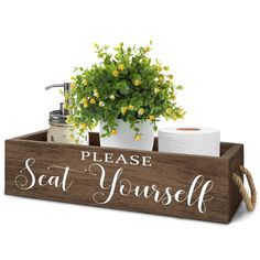 a wooden sign that says, please seat yourself with a potted plant in it