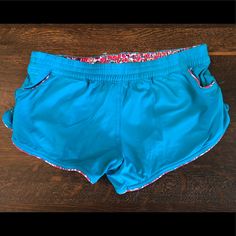 Blue Shorts With Flower Detail Great To Wear Over Swimsuit Nwot Blue Stretch Shorts For Pool, Stretch Blue Shorts For Pool, Stretch Blue Beach Shorts, Blue Stretch Beach Shorts, Blue Athletic Shorts For Pool, Stretch Blue Athletic Shorts For Beach Season, Blue Stretch Shorts For Poolside, Blue Athletic Shorts With Elastic Waistband For Vacation, Summer Sports Bottoms In Turquoise