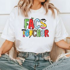 FACS Teacher Shirt, Family and Consumer Sciences Shirt, Home Economics Shirt, FCS Teacher T-shirt, Gift for Teacher, Teacher Sweatshirt Don't hesitate to contact us if you have any questions about colors, sizes, and personalization's.  *Our processing time is 1-2 business days and we're located in Texas, US. *We use high quality DTF Printing to print the designs on an iron-on vinyl. To Order: Select a size, color, and add personalization (if applicable) before adding to your cart.  How to Take C Multicolor Cotton T-shirt With Funny Text, Fun Slogan Tops For School, White Relaxed Fit T-shirt For School, School Shirt With Funny Text And Crew Neck, Multicolor Slogan Crew Neck Top, Multicolor Graphic Tee With Slogan, Multicolor Slogan Graphic Tee, Fun Relaxed Fit T-shirt For School, White T-shirt With Funny Text For School