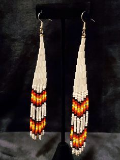 Beautifully crafted Native American earrings that show the simplicity and elegance of Native colors. Made with white pearl bugle beads and beautifully colored seed beads, these will definitely stand out in any way you decide to wear them. White Beaded Long Drop Earrings, White Long Drop Earrings With Colorful Beads, Native American Beadwork Earrings, Mountain Earrings, Native American Earrings, Native Beadwork, Native American Beadwork, Bugle Beads, Beaded Earrings Patterns