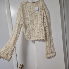 Brand New. Never Worn. Tags Attached. Bell Sleeve Crochet Top. Cream Crochet Top With Open Knit V-neck, Casual Spring Sweater With Crochet Trim, Fall V-neck Crochet Top With Crochet Trim, V-neck Crochet Top With Crochet Trim For Fall, Spring V-neck Crochet Top With Open Knit, Crochet Lace Sweater For Beach In Spring, Fitted Sweater With Crochet Trim, Casual Fitted Sweater With Crochet Trim, Beige Crochet Lace Sweater For Spring