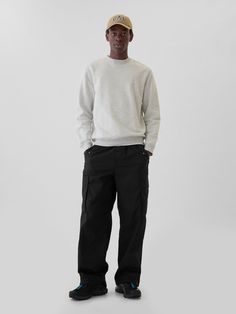 Smooth stretch cotton-blend baggy cargo pants.  Adjustable drawcords at elasticized waist.  Front slant pockets, back zipper pocket.  Cargo pockets at sides.  Elasticized hem.  Fit: Loose.  A baggy silhouette throughout.  Tapered leg.  Models are 6′1″–6′2″ 185 cm–188 cm) with a 31″ 79 cm) waist & 32–33″ 81 cm–84 cm) inseam & are wearing Gap Black Cargo Pants Outfit Men, Black Cargo Pants Outfit, Cargo Pants Outfit Men, Lil Bro, Pants Outfit Men, Cargo Pants Outfit, Baggy Cargo Pants, Black Cargo Pants, Support People