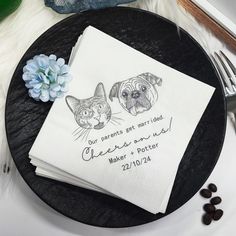 two cats and a dog are drawn on napkins next to each other, with coffee beans in the background