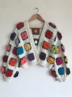 Item Information *Beautiful granny square jacket, handmade. *Don't be afraid to get cold because this cardigan will warm you up all fall and winter. *All sizes are crochet according to demand. *This item is made to order, processing time for this item is around 2-4 days. *You can clean it in wash machine at 30 degrees. *If you have any questions please contact us. (Shipping, size, customization etc.) Handmade Bohemian Sweater For Spring, Handmade One Size Cardigan For Spring, Handmade One Size Spring Cardigan, Handmade One-size Spring Cardigan, Colorful Hand Knitted Cardigan For Spring, Hand Knitted Cardigan For Spring Festival, White Bohemian Handmade Outerwear, Hand Knitted Cardigan For Spring, Colorful Granny Square Sweater For Spring