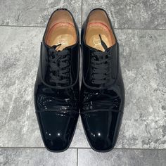 (Worn Once For A Wedding) Christian Louboutin Men’s Greggo Lace Up Shoes Flat Patent Calf Black - In Original Box - With Original Dust Bags Never Used Black Lace-up Oxfords For Galas, Luxury Black Plain Toe Oxfords, Black Cap Toe Dress Shoes For Galas, Formal Cap Toe Dress Shoes With Red Sole, Formal Dress Shoes With Red Sole And Cap Toe, Luxury Black Dress Shoes With Rubber Heel Cap, Classic Lace-up Dress Shoes With Red Sole, Classic Patent Leather Oxfords With Red Sole, Designer Patent Leather Plain Toe Oxfords