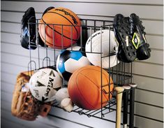 a rack with several different types of sports balls