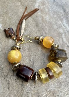 Bohemian Bracelet Vintage Resin, Antique Metal, Leather & African Trade Traditional Brown Beaded Bracelets With Natural Stones, Traditional Brown Beaded Bracelet With Natural Stones, Bohemian Amber Beaded Bracelets Hand-strung, Handmade Bohemian Amber Beads, Rustic Adjustable Jewelry With Large Beads, Bohemian Amber Bracelet With Colorful Beads, Amber Bohemian Bracelets With Colorful Beads, Bohemian Hand-strung Brown Beads, Bohemian Amber Beaded Bracelet