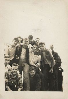 an old black and white photo of young men