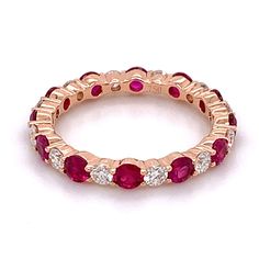 Alternating bands are fun and flirty! You can pretend it's a right hand ring or wear it as a wedding band - you decide one thing we know you will love the shine and dazzle of white diamonds and a deep hue of ruby.Metal: 18K Rose Gold12 Diamond Weight: 0.65ct t.w. 12 Ruby Weight: 1.46ct t.w. Dazzling Ruby Ring With Diamond Accents, Dazzling Ruby Ring With Vvs Clarity, Elegant Red Eternity Band For Anniversary, Dazzling Red Ruby Ring With Diamond Accents, Ruby Eternity Band With Prong Setting For Formal Occasions, Red Ruby Ring With Diamond Accents, Formal Ruby Eternity Band With Prong Setting, Elegant Red Stackable Eternity Band, Dazzling Round Cut Ruby Ring