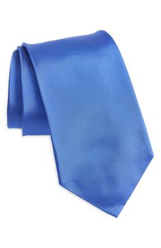 Solid coloring brings effortless versatility to this Italian-made tie crafted from lustrous silk peau de soie for a luxe finish to any look. 3 1/4" width; 57 1/2" length 100% silk Dry clean Made in Italy Blue Silk Tie For Black Tie Events, Spring Silk Ties For Formal Occasions, Elegant Silk Ties For Spring, Formal Satin Ties, Elegant Blue Satin Suit And Tie Accessories, Fitted Blue Silk Suit And Tie Accessories, Formal Silk Ties, Silk Suit And Tie Accessories With Satin Finish, Blue Satin Suit And Tie Accessories For Formal Occasions