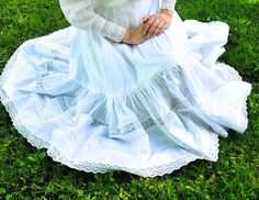 Victorian white cotton petticoat with ruffle and lace. 1900s womens petticoat to fill out skirts in Edwardian and Viciorian style. If you want to wear it this way, it should be shorter than the skirt by about 5 centimeters. Before ordering, write me your waist circumference and the length you want. Edwardian lingerie, will be made to order and tailored for the customer.  According to the pattern and styles listed in the auction. Choose your size from the table or write me a message. *Care: Machi White Regency Style Petticoat With Ruffles, Regency Style Ruffled Petticoat For Daywear, Victorian White Ruffled Petticoat, Victorian White Petticoat With Ruffles, Cotton Victorian Dress With Lace Trim In Cottagecore Style, Victorian White Cotton Petticoat, Cottagecore Victorian Cotton Dress With Ruffles, Victorian Prairie Dress With Lace Trim, Regency Style White Petticoat For Daywear