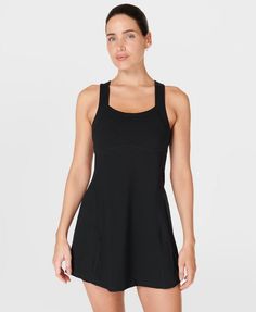 Our sporty new workout dress for styling out the sweatiest of sessions. Sweat-wicking Power Pro fabric is breathable and stretchy with a matte finish. Slim, body-skimming fit with contrasting panels and a flattering racerback. Supportive inner shorts with slip pocket. In-built bra with removable pads. Length: 77.5cm / 31". Model wears size S and is 178cm/5'10" tall. Style Code: SB9287BColour: Black Stretch Racerback Dress With Built-in Bra, Fitted Black Tennis Dress With Built-in Bra, Sporty Scoop Neck Workout Dress, Fitted Racerback Sporty Tennis Dress, Sporty Fitted Racerback Tennis Dress, Black Compression Activewear With Scoop Neck, Functional Stretch Activewear With Scoop Neck, Fitted Moisture-wicking Activewear With Scoop Neck, Scoop Neck Stretch Activewear With Mesh Back