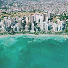 an aerial view of a city and the ocean