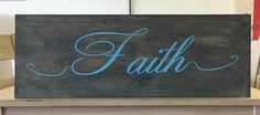 a wooden sign that says faith on it