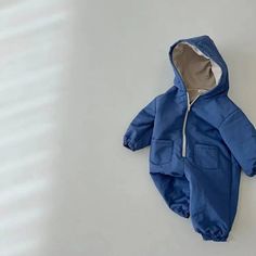 Cozy Solid Color Onesie For Winter, Cozy Solid Onesie For Winter, Winter Long Sleeve Solid Onesie, Long Sleeve Onesie For Winter Playtime, Long Sleeve Onesie For Playtime In Winter, Winter Jumpsuits And Rompers With Pockets, Winter Cotton Onesie, Hooded Cotton Onesie For Playtime, Cotton Hooded Onesie For Playtime