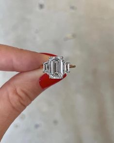 ITEM INFORMATION:✦ Main Stone Details ✧ Shape: Emerald Cut Moissanite ✧ Weight: 3.00 CT (App.) ✧ Dimension: 7.0 x 10.0 MM (App.) ✧ Color: G-H (Near Colorless) ✧ Clarity: VVS ✦ Side Stone Details ✧ Shape: Trapezoid Cut Moissanite ✧ Weight: 1.00 CT (App.) ✧ Color: G-H (Near Colorless) ✧ Clarity: VVS ✦ Ring Details ✧ Band Width: 1.50 mm (± 0.10) [Customized Possible]✧ Metal: Gold 10KT , 14KT , 18KT , Silver 925 Sterling✧ Metal Tone: Yellow, White, Rose ✧ Stamp/Hallmark: Yes ✧ Engraving: Free (Pleas Swirl Engagement Rings, Moissanite Bridal Sets, Emerald Cut Engagement, Emerald Cut Moissanite, Emerald Cut Rings, Emerald Engagement Ring Cut, Lab Grown Diamonds Engagement, Gemstone Engagement, Three Stone Engagement Rings