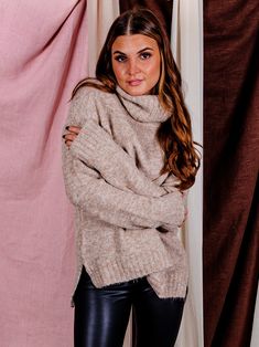 Our In Session Turtleneck Sweater is a must this season! This gorgeous taupe sweater is made from a soft, cozy and stretchy knit fabrication, and features a longer length and long sleeves to keep you warm all season long. Dress it up with jeans and booties for a stylish look, or pair it with leggings and sneakers for a casual-cool outfit. Whatever your style, this sweater is sure to become one of your favorites this season! Color: Taupe Relaxed Fit Ribbed Hemline + Cuffs Turtleneck Long Sleeves Chic Chunky Knit Turtleneck For Fall, Chic Chunky Knit Turtleneck For Winter, Chic Chunky Knit Winter Turtleneck, Winter Stretch Textured Knit Turtleneck, Winter Textured Knit Stretch Turtleneck, Trendy Cozy Fit Beige Sweater, Snug Trendy Sweater For Fall, Trendy Snug Sweater For Fall, Beige Winter Sweater For Cold Weather