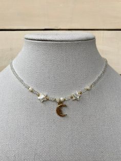 this gorgeous celestial necklace is perfect for anyone who loves the moon. Celestial Moon Charm Necklace For Jewelry Making, Adjustable Celestial Necklace With Star Charm, White Moon Charm Necklace, White Moon Phase Celestial Necklace, White Celestial Moon Phase Necklace, White Celestial Necklace With Star Charm, Bohemian White Necklace With Moon Charm, White Celestial Necklace With Moon Phase, Handmade White Celestial Necklace