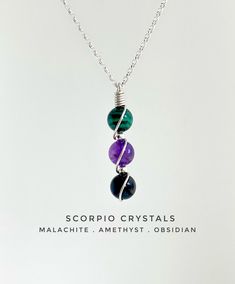 Scorpio Zodiac Necklace, featuring crystals, Malachite, Amethyst and Obsidian. Perfect Astrology Christmas gift! THE NECKLACE - The 3.5cm long pendant is hung on a Sterling Silver belcher chain, with bolt clasp and 925 hallmark.  The Stones are separated with small sterling silver beads and hand wrapped in sterling silver wire. THE PRESENTATION BOX - Each of my designs come in a Drops of Earth kraft gift box with a silver polishing cloth. A description of the stone including history and properties is included in the lid of the box. THE PACKAGING - Following my own aim to reduce my consumption of single use plastic, the gift box will arrive wrapped in brown card bubble wrap and the outer envelope is made using sugarcane and is fully recyclable. Spiritual May Birthstone Crystal Necklace, May Birthstone Crystal Necklace For Healing, Mystical Crystal Necklaces With Round Beads For Gifts, Mystical Crystal Necklace With Round Beads For Gift, Crystals Malachite, Hand Knotted Jewelry, Zodiac Necklace Scorpio, Scorpio Necklace, Earth Gift