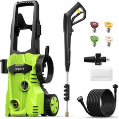 a green and black pressure washer with hoses, spouting water and other accessories