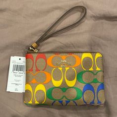 Questions? Leave A Comment Below! Coach Multicolor Travel Wristlet, Coach Multicolor Wristlet For Travel, Multicolor Coach Wristlet For Travel, Multicolor Pouch Bag With Wrist Strap, Coach Multicolor Wristlet, Multicolor Coach Wristlet For Daily Use, Coach Multicolor Wristlet For Everyday, Multicolor Everyday Wristlet With Removable Pouch, Multicolor Bags With Wrist Strap For Daily Use