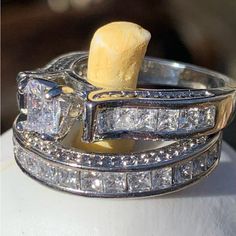 a couple of rings that are sitting on top of each other with some diamonds in them