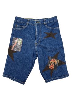 a pair of blue jean shorts with pictures and stars on the side, all in different colors