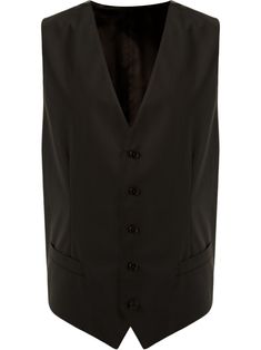 Domenico Dolce and Stefano Gabbana are the reigning kings of Italian glamour, as seen in this black wool blend button-down gilet. Featuring a v-neck, a sleeveless design, two front pockets and a buckle fastening at the rear. | Dolce & Gabbana Button-Down Gilet Italian Glamour, Men Vest, Stefano Gabbana, Versace Outfit, Outerwear Vest, Dolce E Gabbana, Jacket Sale, Shirt Sale, Black Wool