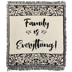 a black and white throw with the words family is everything