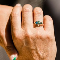 St. Martin Seas a dreamy blue and green cluster ring for all the tropical lovers out there. Takes you away to tropical oceans with a warm breeze with a glance of our eye. 1ct round Blue Zircon 6mm .80ct Oval Green Tourmaline 6x4mm 2.5mm round white diamond 2.25mm Green emerald 1.75mm round salt and pepper diamond 1.6mm smooth band 14k recycled yellow gold bezel settings Hammered Engagement Ring, Suede Box, Pepper Diamond, Custom Ring Designs, St Martin, Antique Diamond, Blue Zircon, Salt And Pepper Diamond, Perfect Engagement Ring