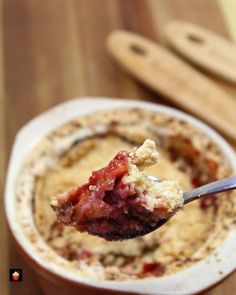 a spoon full of food in a bowl