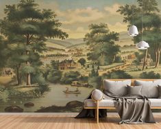 a living room with a couch and wallpaper that has a painting on the wall