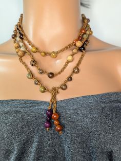 Discover the charm of bohemian fashion with this exquisite Aromatic Mixed Sandalwood Beaded Crochet Boho Necklace. Handcrafted with a meticulous eye for detail, this necklace features a harmonious blend of fragrant sandalwood beads, each carved and polished to a smooth finish. Perfect for those who appreciate unique, artisan-crafted jewelry, this necklace adds a touch of natural elegance to any outfit. The versatile design allows it to be wrapped or layered, making it an ideal gift for any occasion. Embrace the art of boho chic with this elegant and aromatic accessory. This beautiful handmade crochet beaded Necklace is made using aromatic sandalwood beads, waxed cord and Measures 63 inches and is a tie-on necklace no clasp and could be wrapped several ways for a different look every time, Adjustable Multi-strand Wooden Bead Jewelry, Spiritual Wooden Beads, Bohemian Lariat Beaded Necklaces With Colorful Beads, Artisan Brown Beaded Necklace For Beach, Bohemian Lariat Beaded Necklace With Colorful Beads, Adjustable Brown Beads For Crafting, Adjustable Natural Jewelry With Wooden Beads, Bohemian Necklaces For Meditation, Adjustable Bohemian Necklace For Meditation