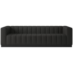 a black couch sitting on top of a white floor