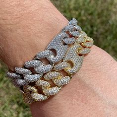 Premium 14k white gold OR 14k yellow gold plated diamond figaro cuban link Bracelet! -Plating is PVD which is the highest quality. -Stones are high quality VVS simulated lab diamonds(CZ)! Hand prong set and not glued in like the cheap ones! -Very nice box clasp! -16mm wide. -Comes in 7 or 8 inch. -Brass base metal. -Nice weight to it. Very solid piece. -Comes in gift box. FAST SHIPPING!*TRUSTED SELLER**4400+ SOLD* -NEW! -Very good quality bracelet. Looks even better in person. -For men and women Gold Iced Out Diamond Bracelet, Gold Cuban Link Diamond Bracelet, Luxury Cuban Link Bracelet With Bling, Luxury Bling Cuban Link Bracelets, Gold Iced Out Round Tennis Bracelet, Yellow Gold Iced Out Cuban Link Bracelet, Silver Link Bracelet With Cubic Zirconia, Gold Iced Out Tennis Bracelet For Anniversary, Classic Cuban Link Iced Out Jewelry