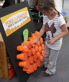 Poke a pumpkin. Filled with tricks AND treats :) we should do this for Fall Fest next year! or we could do it for Christmas in sunday school. make it like ornaments on a tree Poke A Pumpkin, Dekorasi Halloween, Kid Friendly Halloween, Skirt Diy