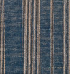 a blue and beige striped rug with vertical stripes on the bottom, in two rows