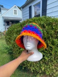 This simple and cute rainbow crochet bucket hat is made with 100% acrylic yarn. This hat is a unisex hat and is cute and simple granny stitch design.  Perfect for a cute head accessory for outfits, outings or any activities. HANDWASH AND AIRDRY THIS MATRIAL HAS A SLIGHT STRETCH Measurement of head circumference  medium adult (21-23inches) large adult (24-25inches) Colorful Crochet Casual Hats, Colorful Crochet Hat One Size Fits Most, Colorful Crochet Hat One Size, Multicolor Crochet Beanie Hat, Multicolor Crochet Yarn Cap, Multicolor Knitted Crochet Hat In Cotton, Multicolor Knitted Cotton Yarn Hat, Hand Knitted Multicolor Crochet Hat In Cotton Yarn, Multicolor Hand Knitted Crochet Cotton Hat