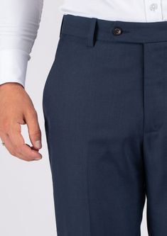 The Navy Sharkskin pants are the perfect choice for any smart occasion. Crafted with a luxurious navy sharkskin fabric and custom made for a premium appearance, they have a deep blue color, a stylish and modern cut, and will make you look and feel confident. Elegant Navy Bottoms For Semi-formal Occasions, Formal Navy Bottoms With Welt Pockets, Navy Formal Bottoms With Welt Pockets, Classic Navy Dress Pants For Business Casual, Elegant Navy Tapered Leg Dress Pants, Navy Elegant Tapered Leg Dress Pants, Tailored Navy Pants For Semi-formal Occasions, Navy Fitted Bottoms For Semi-formal Occasions, Tailored Navy Semi-formal Pants