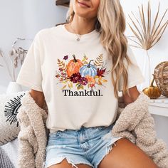 Embrace the holiday season with our Bella Canvas® "Floral Pumpkin Thankful" T-shirt! Welcome to Christi Creations! Here you will find that unique outfit for a special occasion! We have been in business over 14yrs here on Etsy and can assure you that you will receive 5 Star service! Thank you for supporting our small family business:) This listing is for the "Floral Pumpkin Thankful" t-shirt as shown. The brand of this tee is Bella Canvas® which is a soft, high quality tee. Shirts are available in a variety of colors that you may choose from. Please refer to size chart provided in listing photos for reference. A color chart is also provided in listing photos. These shirts are made here in our design studio making sure you receive the perfect product. Please visit our store for more great gi Thankful Pumpkin, Autumn Sweater, Floral Pumpkin, Preppy Fall, Unique Outfit, Pumpkin Fall, Trendy Fall, Fall Shirt, Thanksgiving Shirts