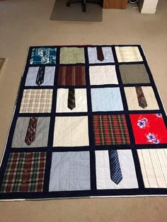 a quilt made to look like ties are on the floor